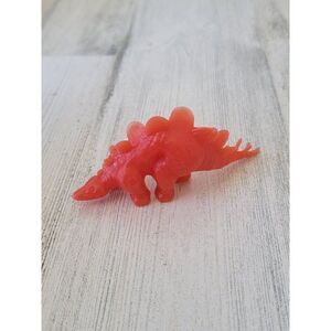 Red stegosaurus dinosaur toy action figure